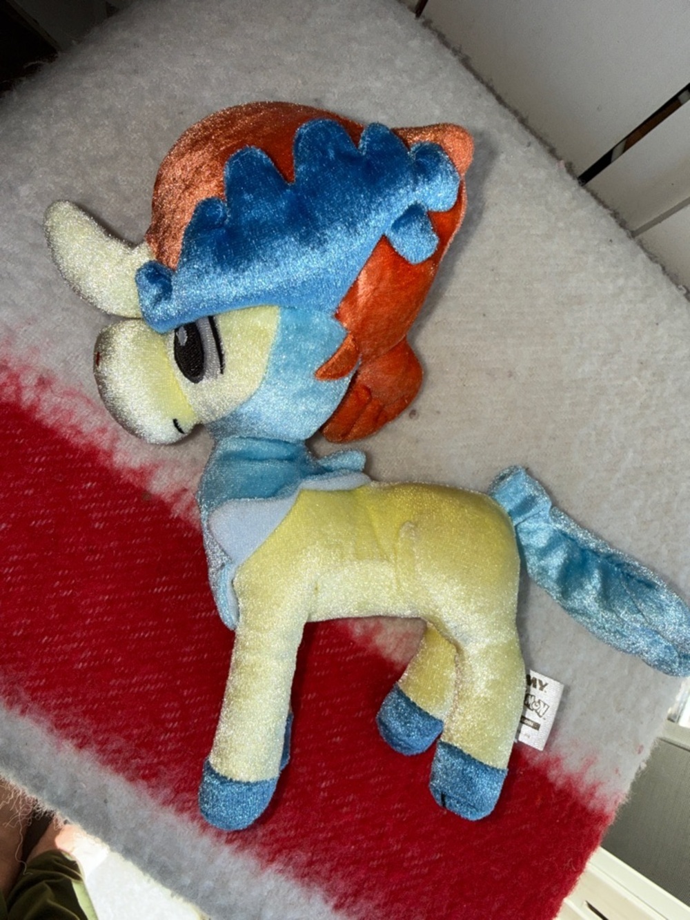 Pokémon Keldeo plush, likely a TOMY 8-inch 20th Anniversary Edition plush
